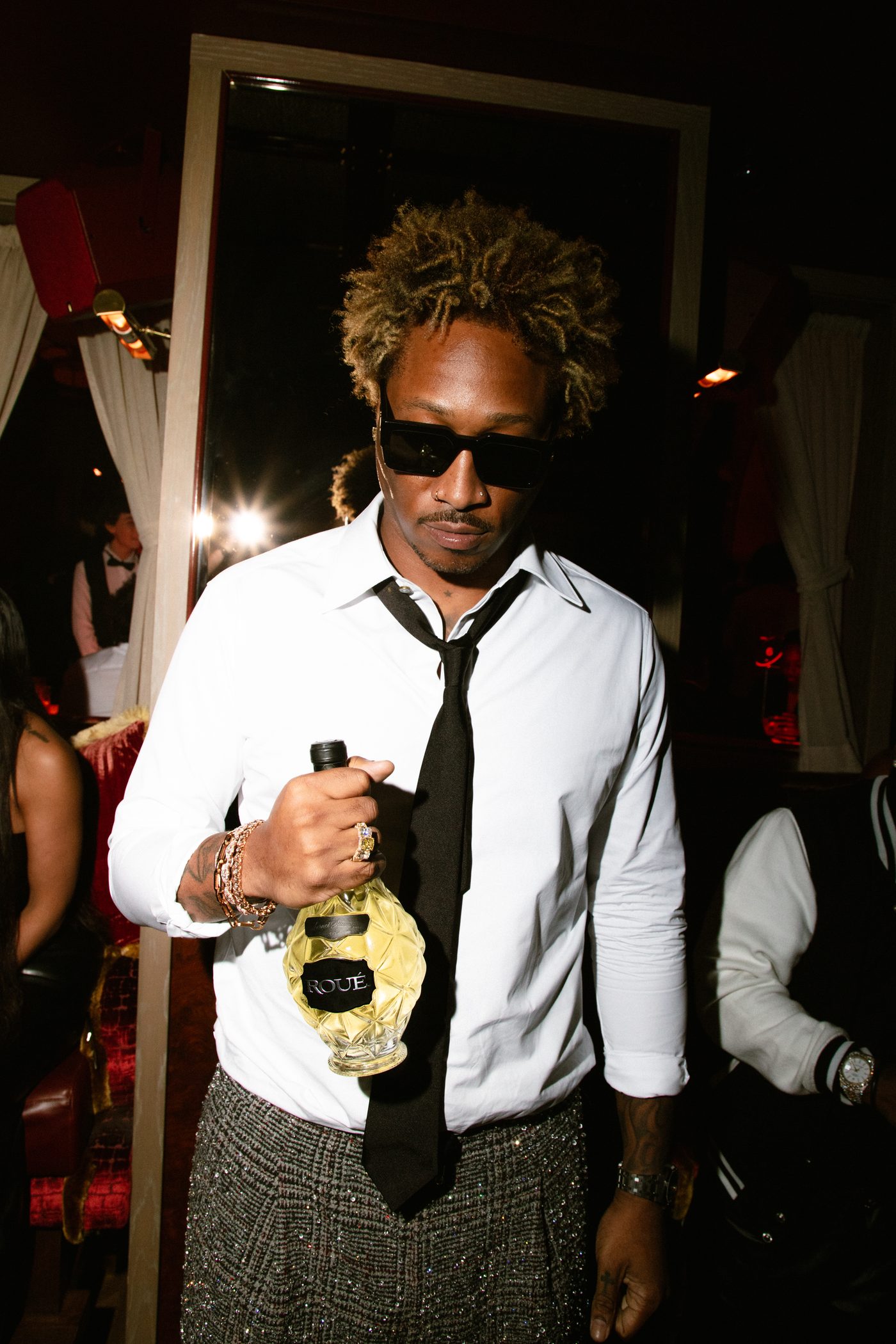 Future holding a bottle of Roué at the launch
